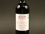 a bottle of wine that is sitting on a table
