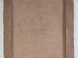 painting of a brown frame with a white wall in the background