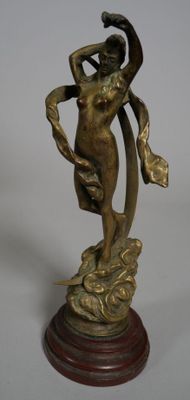 bronze statue of a woman holding a fan on a wooden base