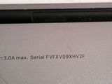 the back of a laptop computer with a small screen on top of it