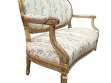 an image of a chair with a floral upholstered back and arms