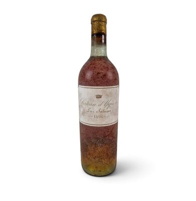 a bottle of wine that is sitting on a white surface