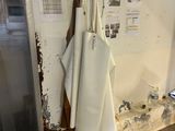 an image of a kitchen with a lot of things hanging on the wall
