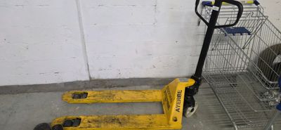 a cart and a hand truck in a garage