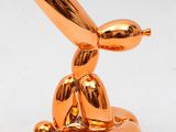 an image of a gold balloon shaped like a rabbit