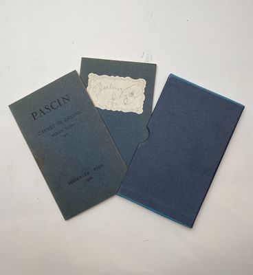 three books sitting on top of a white table next to each other