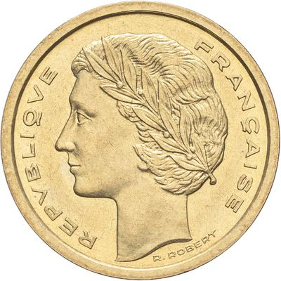 une image montrant un gros plan d'une pièce de monnaie à l'effigie d'une femme