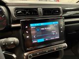 the dashboard of a car with a digital display in the center