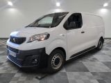 the white van is parked on a checkered floor in a room