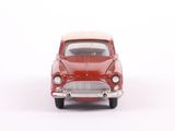 a red toy car that is sitting on a white surface