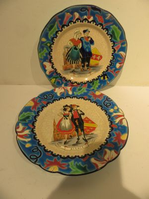 two plates with a picture of a man and a woman on them