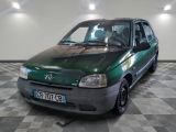 a picture of a green car parked in a garage