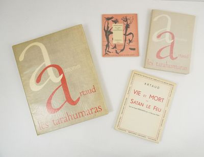 three books are sitting on a white surface with a white background