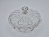 an image of a glass covered dish on a white surface