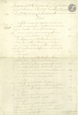 un vieux document écrit posé sur une table