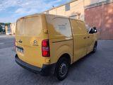a yellow van that is parked in a parking lot