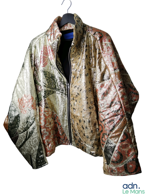 a jacket hanging on a hanger on a white background