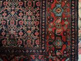 a close up of a rug on a white surface