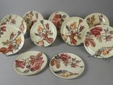 several plates with different designs on them sitting on a table