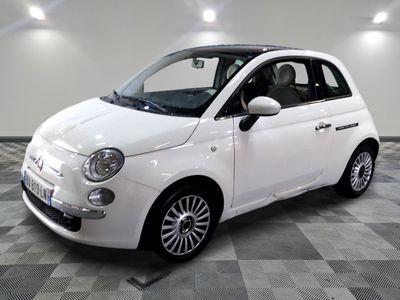 a picture of a small white car on a checkered floor