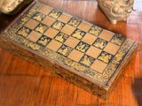a wooden box that has a chess board inside of it