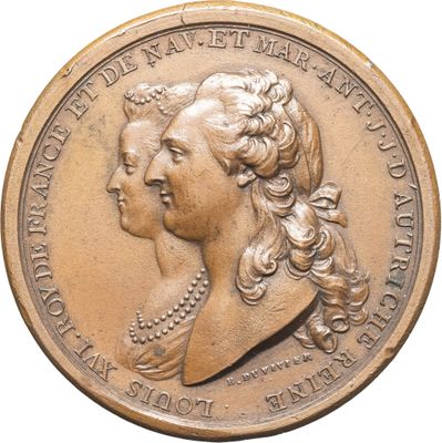 une image représentant une médaille d'or sur laquelle figure le profil d'une femme