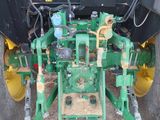 an image of a tractor that is parked in the dirt