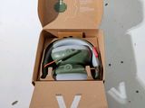 a cardboard box with a pair of headphones in it