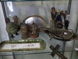 a glass display case with a lot of items on it