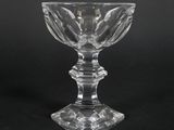 a clear glass cup on a black background with a black background