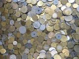 a lot of coins that are on the table