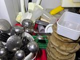 a lot of kitchen utensils in a bowl on a table