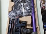 a box with a vacuum and other items in it