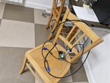 a desk with a computer and a chair in front of it