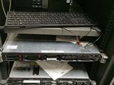 several laptops are stacked on top of each other in a rack