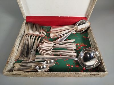 a box with silverware in it on a table