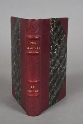 the book is red and black with gold lettering on it