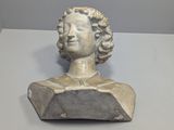 a statue of a woman that is sitting on a table