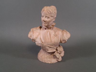 a statue of a woman that is sitting on a table