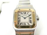 an image of a silver and gold wrist watch with roman numerals