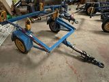 a picture of a trailer with a dolly attached to it in a garage