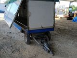 a trailer that has a tent on the back of it