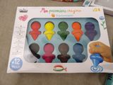 a box that has a bunch of different colored toys in it