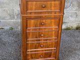 an old wooden chest of drawers with marble top