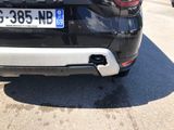 a picture of a black car parked on the side of the road