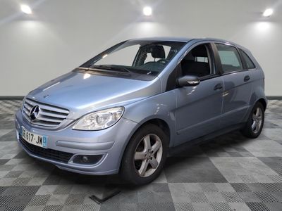 a picture of a blue mercedes b - class parked on a checkered floor