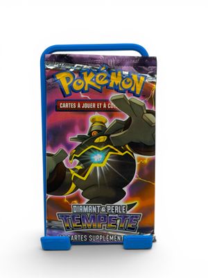 a close up of a box of pokemon trading cards on a white background