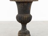 a large vase that is sitting on the floor