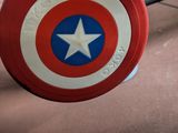 a captain america shield on the ground in the gym