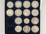 an image of a box of coins with a variety of coins in it